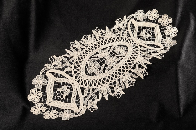 Premium Photo | Decorative lace on black background