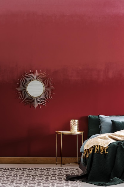 Decorative mirror on burgundy wall