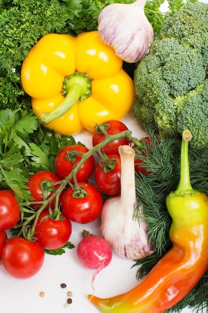 Decorative pattern of fresh vegetables on white