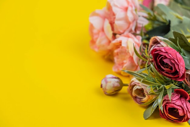 Decorative peonies flowers on yellow background.