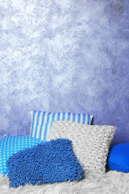 Decorative pillows on grey background