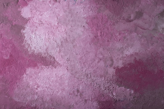 Decorative pink plaster texture, wallpaper close-up, wall pattern.