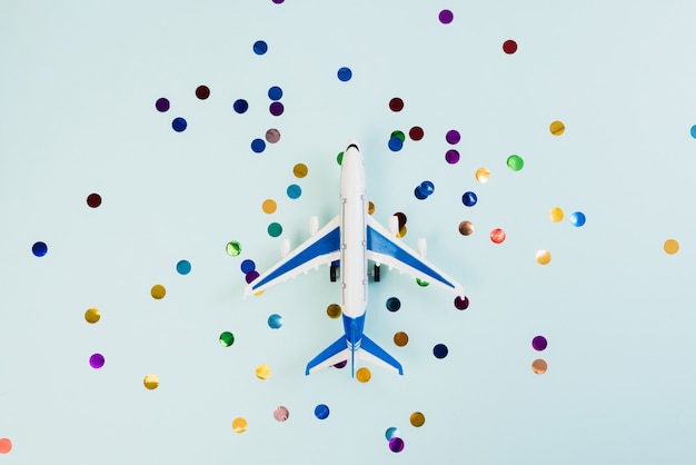 Decorative plane on colored confetti