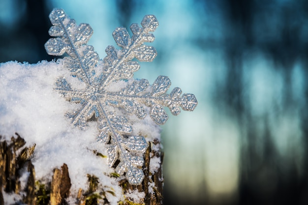 Decorative snowflake sticking out of the snow