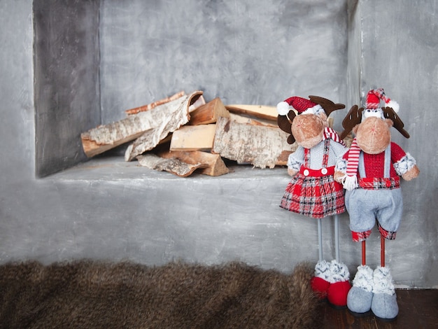 Decorative wood burning fireplace with christmas decor, selective focus.