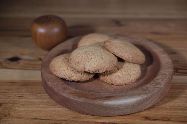 a decorative wooden plate is very beautiful for vegetables and cookies sweets and desserts