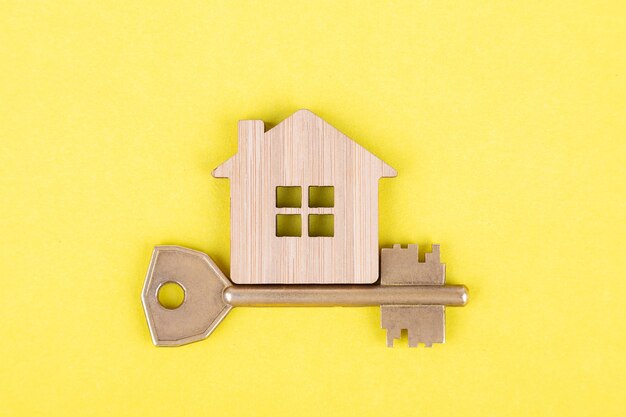 Decorative wooden symbol of a house with a key