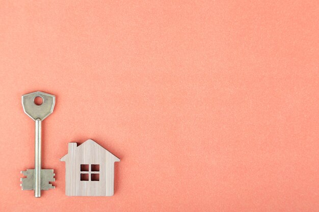 Decorative wooden symbol of a house with a key