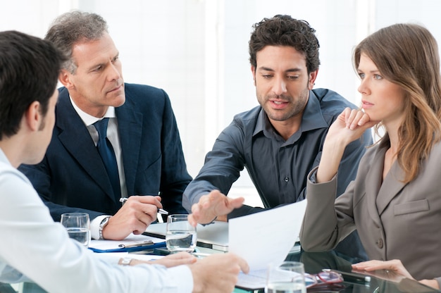 Dedicated business people discussing together their strategy at office