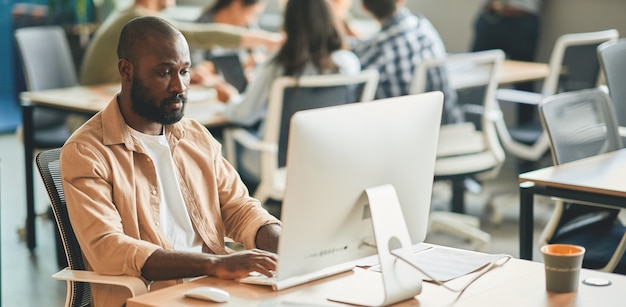 Dedicated man being productive at his office