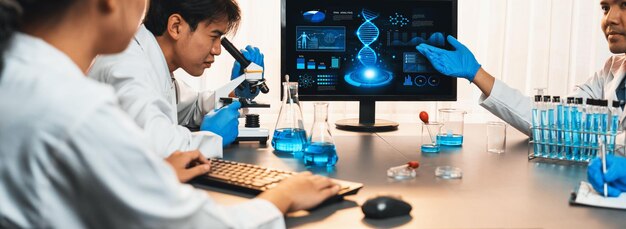 dedicated scientist group working on advance biotechnology computer software to study or analyze dna data after making scientific breakthrough from chemical experiment on medical laboratory neoteric
