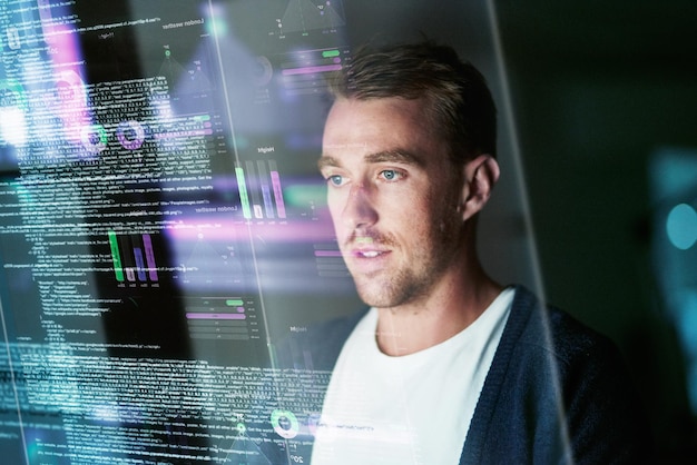 Photo dedicated to software development. cropped shot of a young computer programmer looking through data.