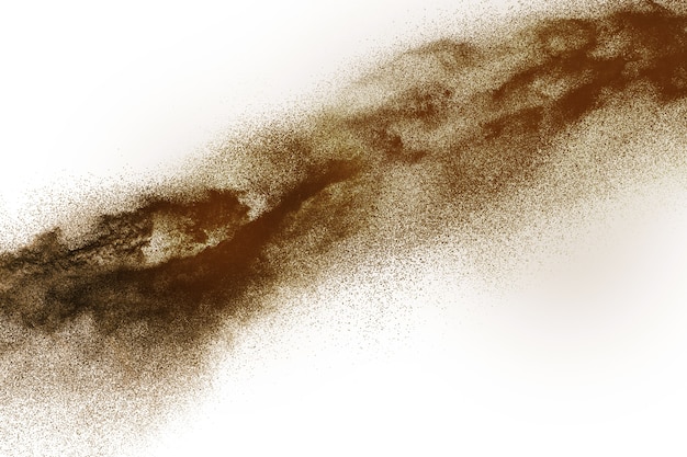 Deep Brown particles splattered on white background. Brown dust splash.