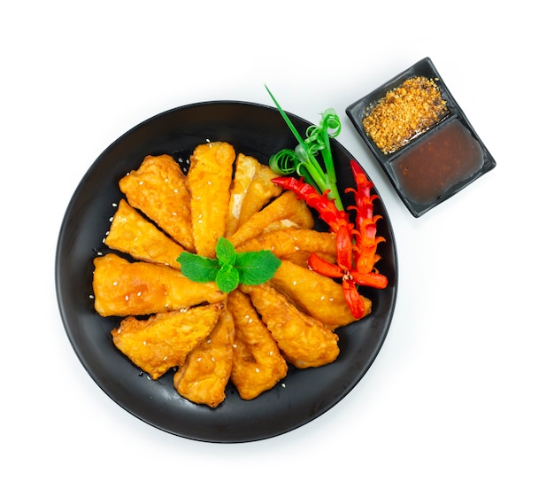 Deep Fried Bamboo Shoots Crispy Appetizers dish served Sweet Peanuts Sauce and Spicy Sauce Asian food fusion dish decoration with carving Chili topview