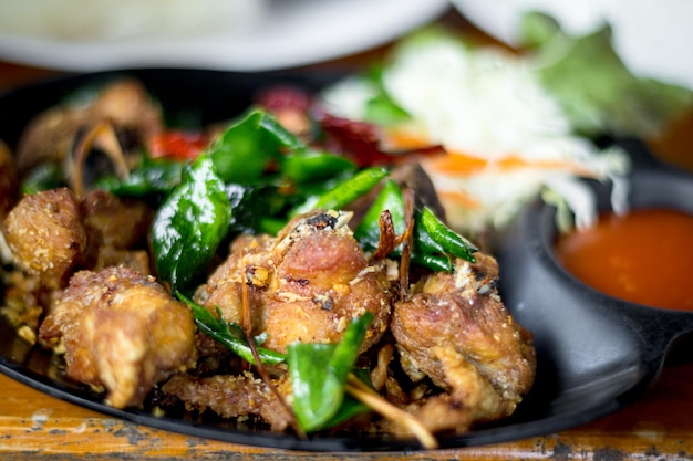 Deep fried chicken with Thai herbs It's marinated with sauce and Thai herbs garlic pepper