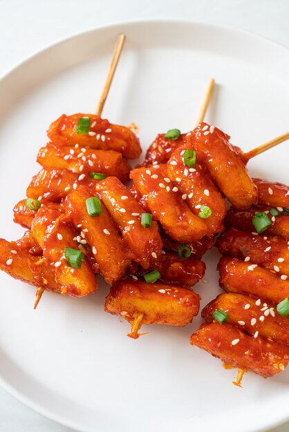 deep fried Korean rice cake (Tteokbokki) skewered with spicy sauce - Korean food style