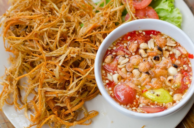 Deep fried papaya salad with spicy sauce 