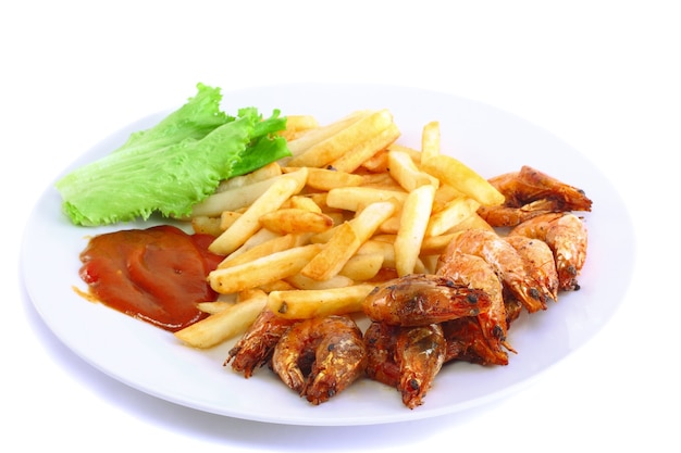 Deep-fried potatoes with fry shrimps and lettuce. Isolated over white background