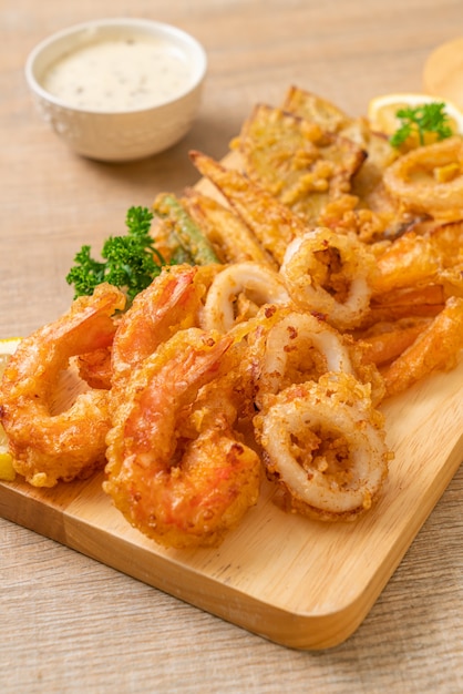 Deep fried seafood (shrimps and squid) with mix vegetable - unhealthy food style