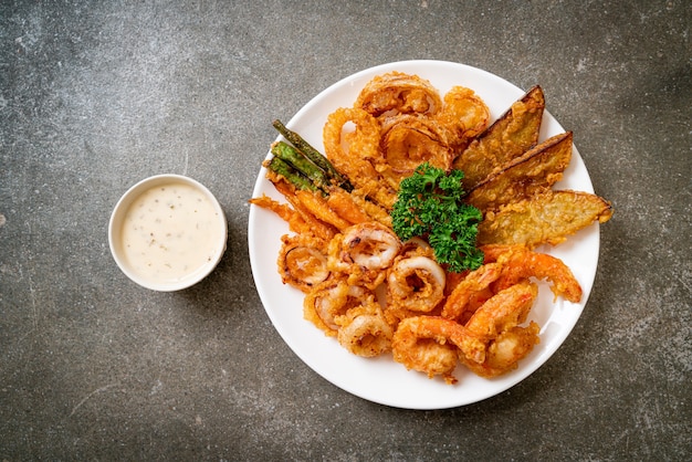 deep fried seafood (shrimps and squid) with mix vegetable - unhealthy food style