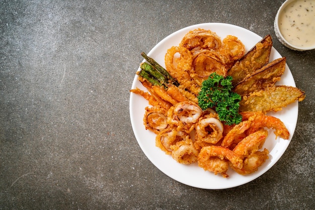 deep fried seafood (shrimps and squid) with mix vegetable - unhealthy food style