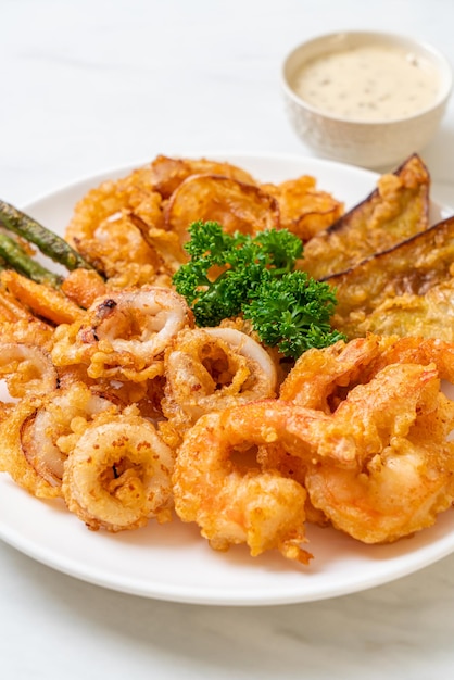 deep fried seafood (shrimps and squid) with mix vegetable - unhealthy food style