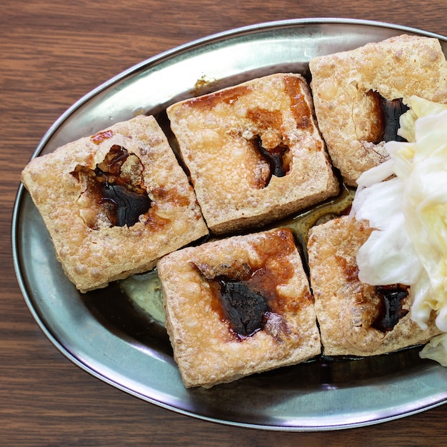 Deep fried stinky tofu with pickled cabbage vegetable