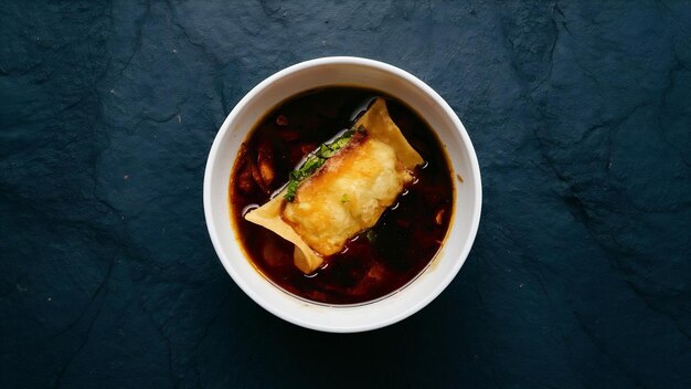 Deep fried wonton on the dark surface