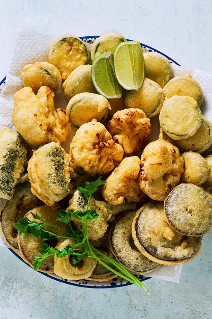 Deep frying vegetables in a plate on the table vegan option