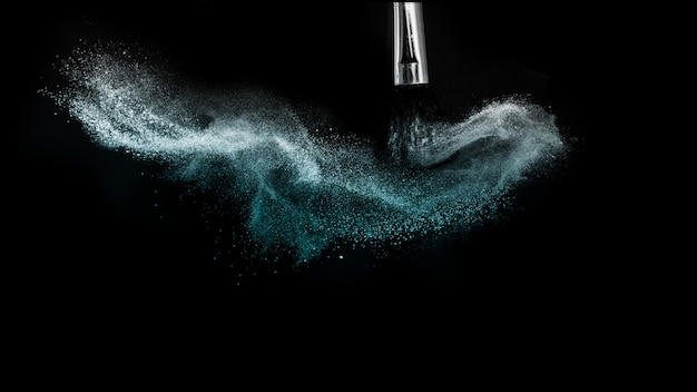 Deep ocean powder color splash and silver brush for makeup artist