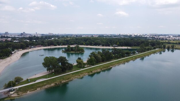 Deep river in greenery near the city