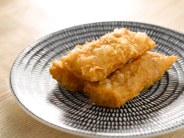 DeepFried Beancurd Skin Roll With Shrimp served in dish isolated on table top view of food