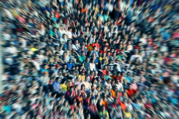 Defocused background of crowd of people in a stadium at a baseball match