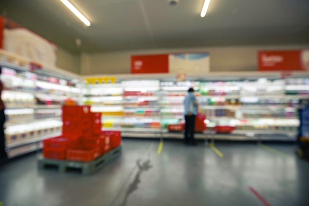 Defocused blur of female box sorting rack cart milk