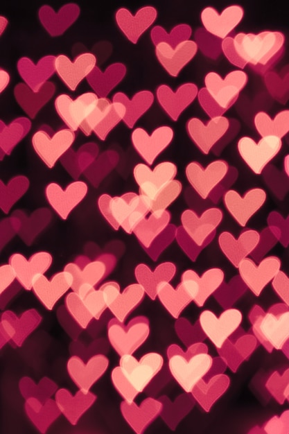 Defocused bokeh background with pink hearts