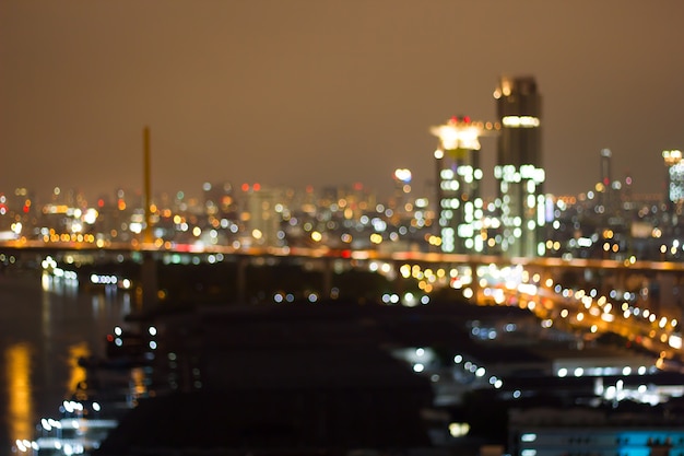 Defocused city night filtered bokeh abstract background.