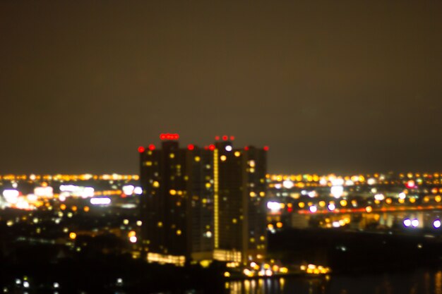 Defocused city night filtered bokeh abstract background.