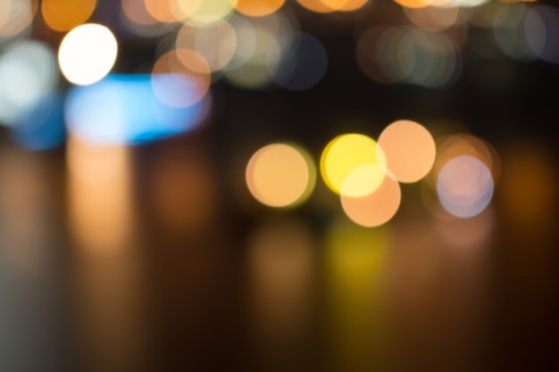 Defocused city night light blurred with bokeh abstract background.