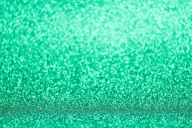 Defocused green glitter background