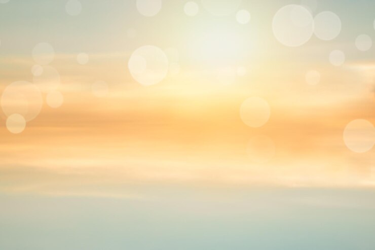 Photo defocused image of bubbles against sky during sunset