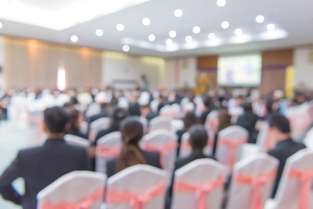 Defocused image of business conference in auditorium