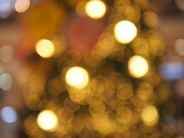 Photo defocused image of illuminated christmas lights at night