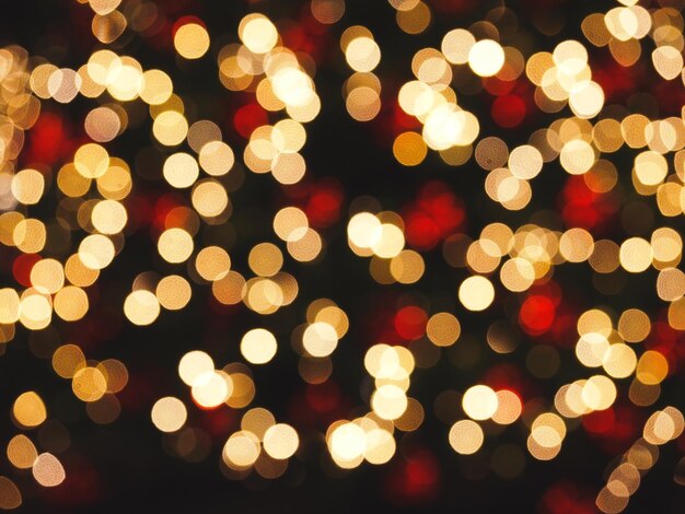 Photo defocused image of illuminated christmas lights at night