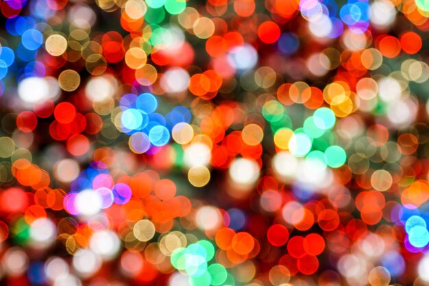 Defocused image of illuminated christmas lights at night