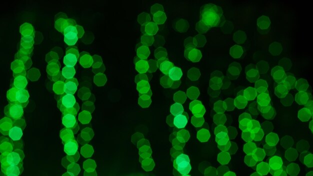 Photo defocused image of illuminated christmas lights at night