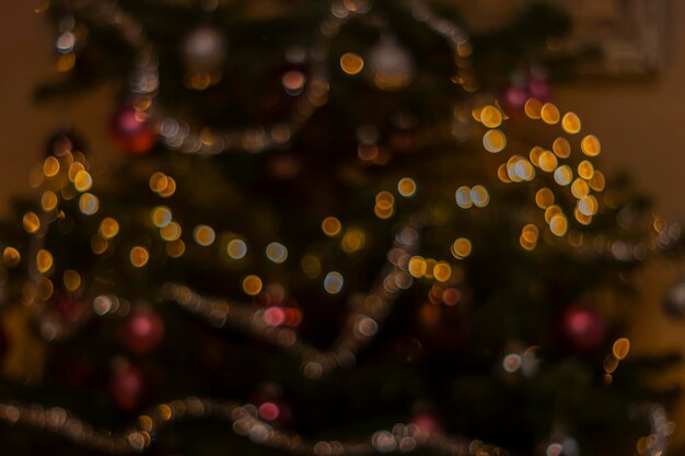 Defocused image of illuminated christmas tree