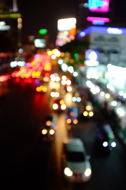 Photo defocused image of illuminated city at night