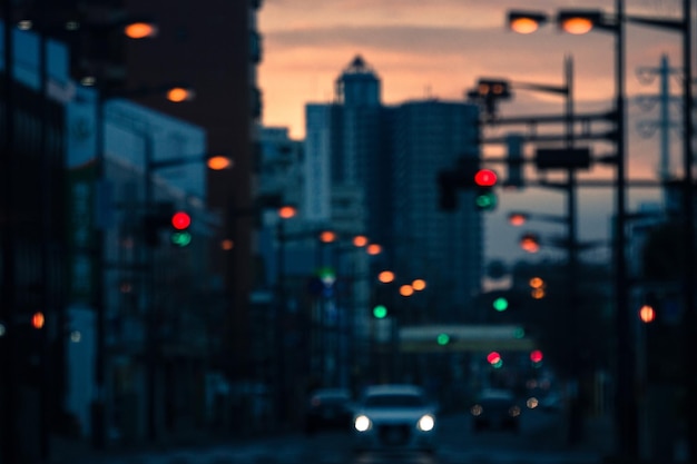 Photo defocused image of illuminated city at night