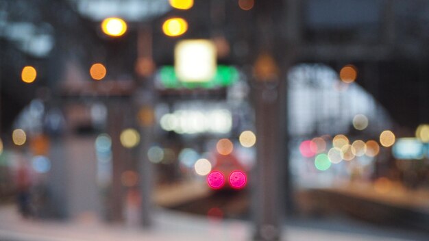 Defocused image of illuminated city street at night