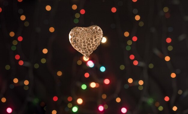 Photo defocused image of illuminated heart shape at night